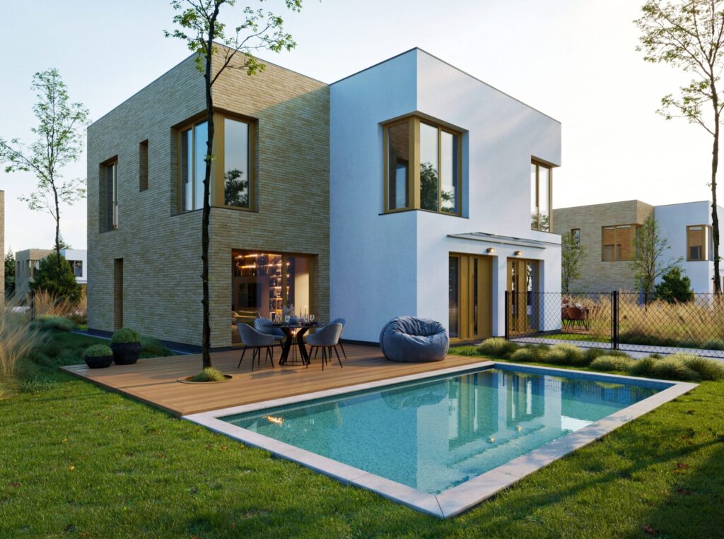 Moderní dvoupodlažní rodinný dům s velkými okny, terasou a zahradním bazénem v klidné zeleni; ukázka komfortního, úsporného bydlení.